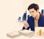 Employee reviews payslips, contract papers, and bank records at a desk.